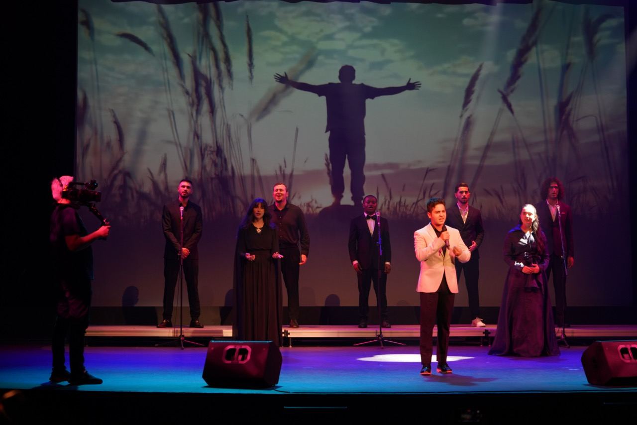 Singers performing on stage during Naat Night