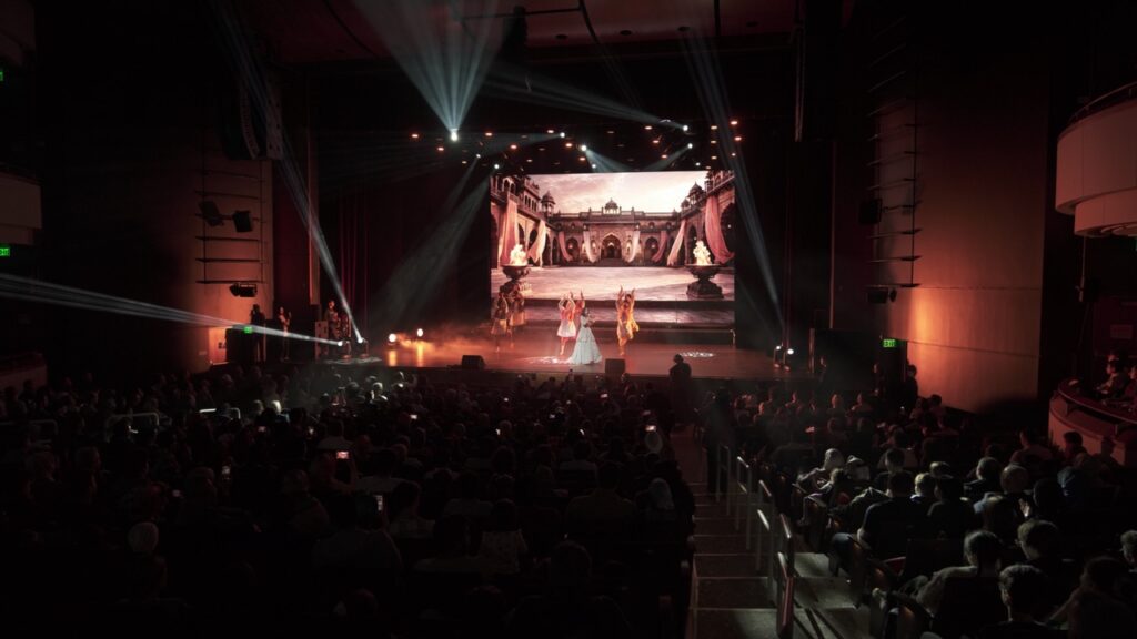 Balcony view of a dance performance with a palace scene on the LED wall at Sandy Springs Performing Arts Center